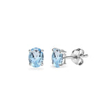 Sterling Silver Blue Topaz 5x3mm Oval-Cut Solitaire Stud Earrings - Presidential Brand (R)