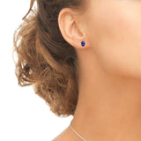 Yellow Gold Flashed Sterling Silver Created Blue Sapphire 7x5mm Oval-Cut Solitaire Stud Earrings - Presidential Brand (R)