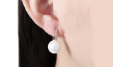 Micro-Pav'e Swarovski Crystal Curved Pearl Huggie Earrings Set in 18K Gold - Presidential Brand (R)
